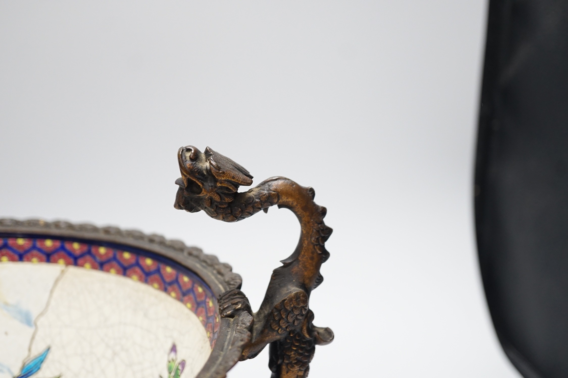 A 19th century French Longwy style ormolu mounted faience bowl on ornate dragon design stand, 23cm high